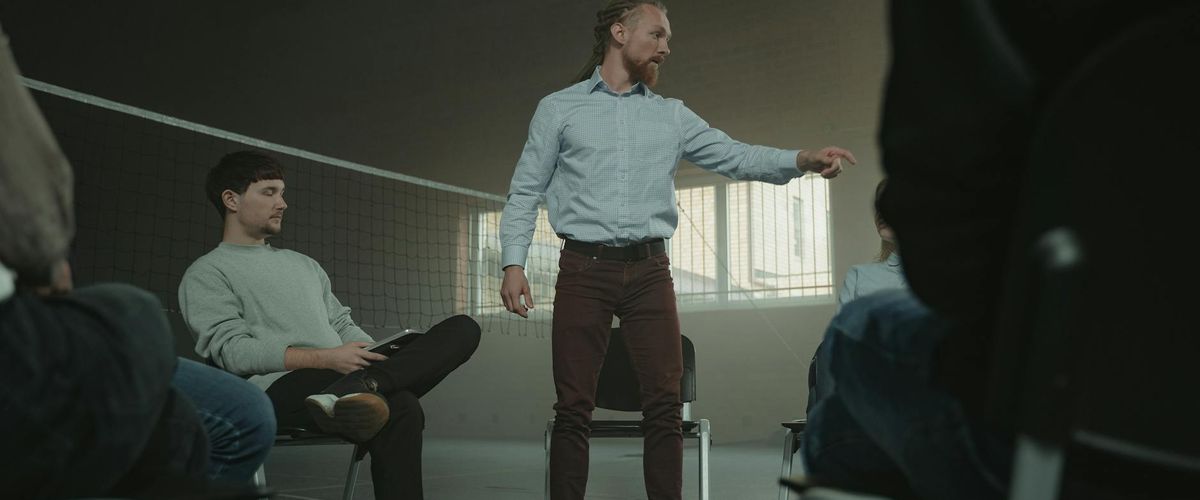 Group of people practicing mindfulness in a spacious hall